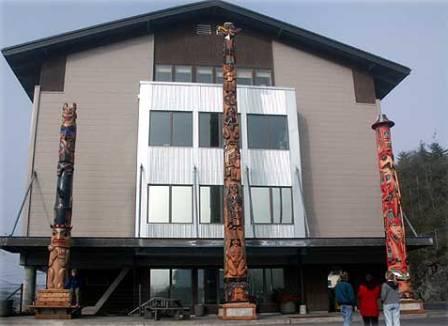 Three gorgeous Native American totem poles stand in front of the KIC building in Ketchikan Alaska