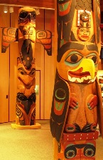 Three Totem Poles are inside the Discovery Center in Ketchikan Alaska