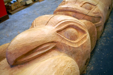 An Eagle and Whale is carved on the Native American Totem Poles at Potlatch Park