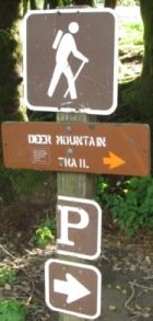 Signs marking the Deer Mountain trail in Ketchikan - one of the best hiking trails in Alaska